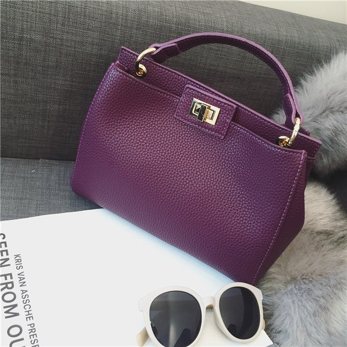 Stylish Women's Cat Bag with Gold Lock Closure