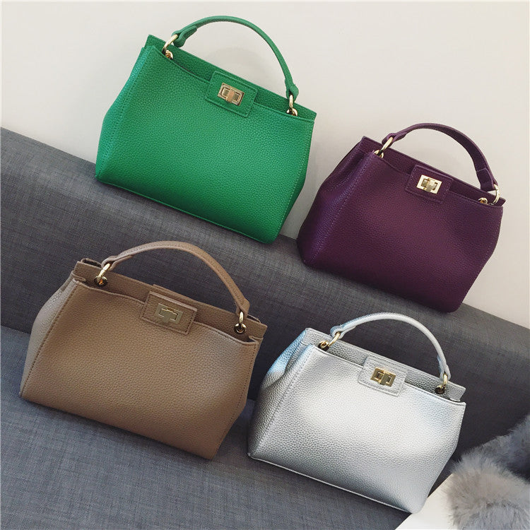 Stylish Women's Cat Bag with Gold Lock Closure